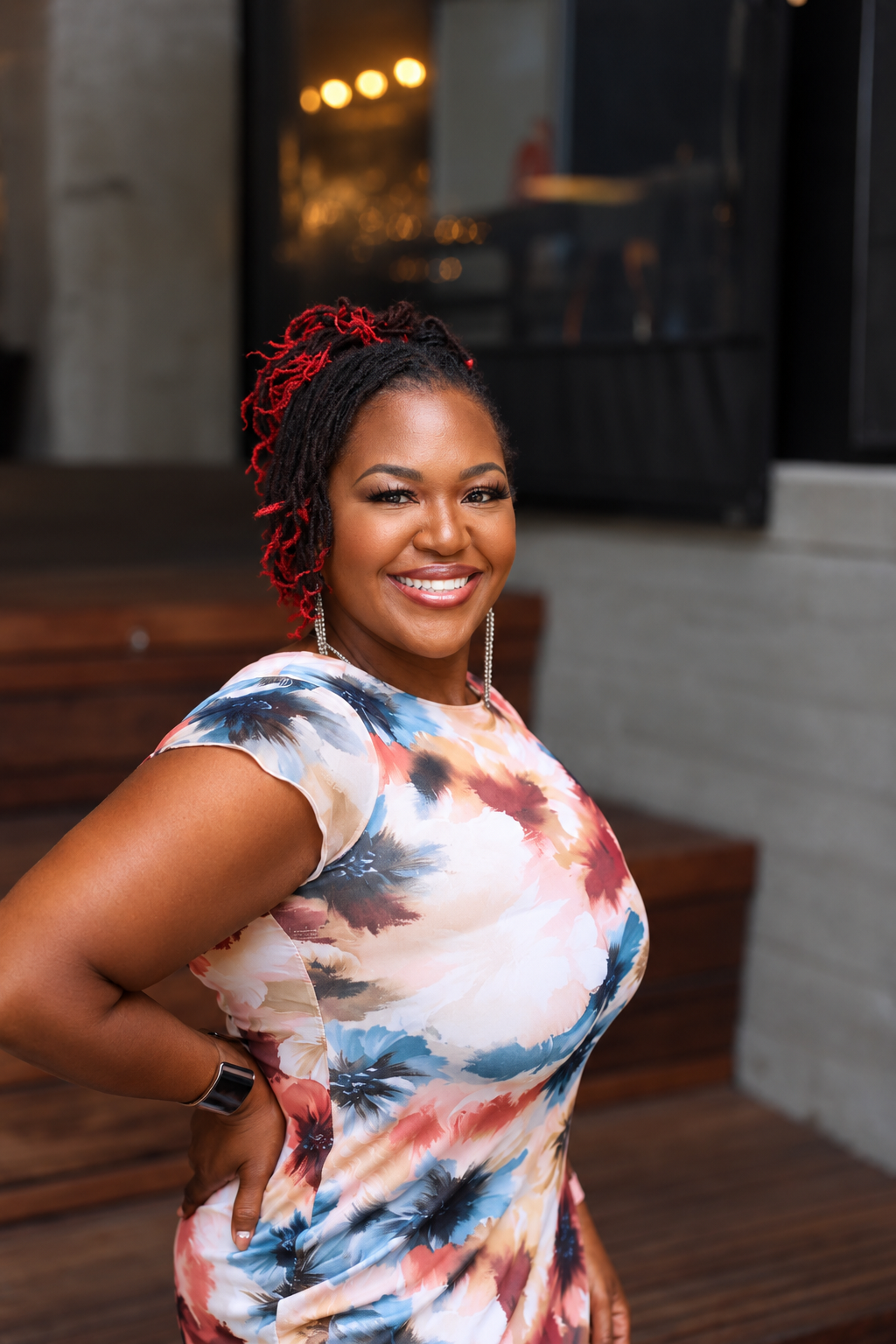 Portrait of Dr. Shermnae D. Jones smiling, wearing a floral dress